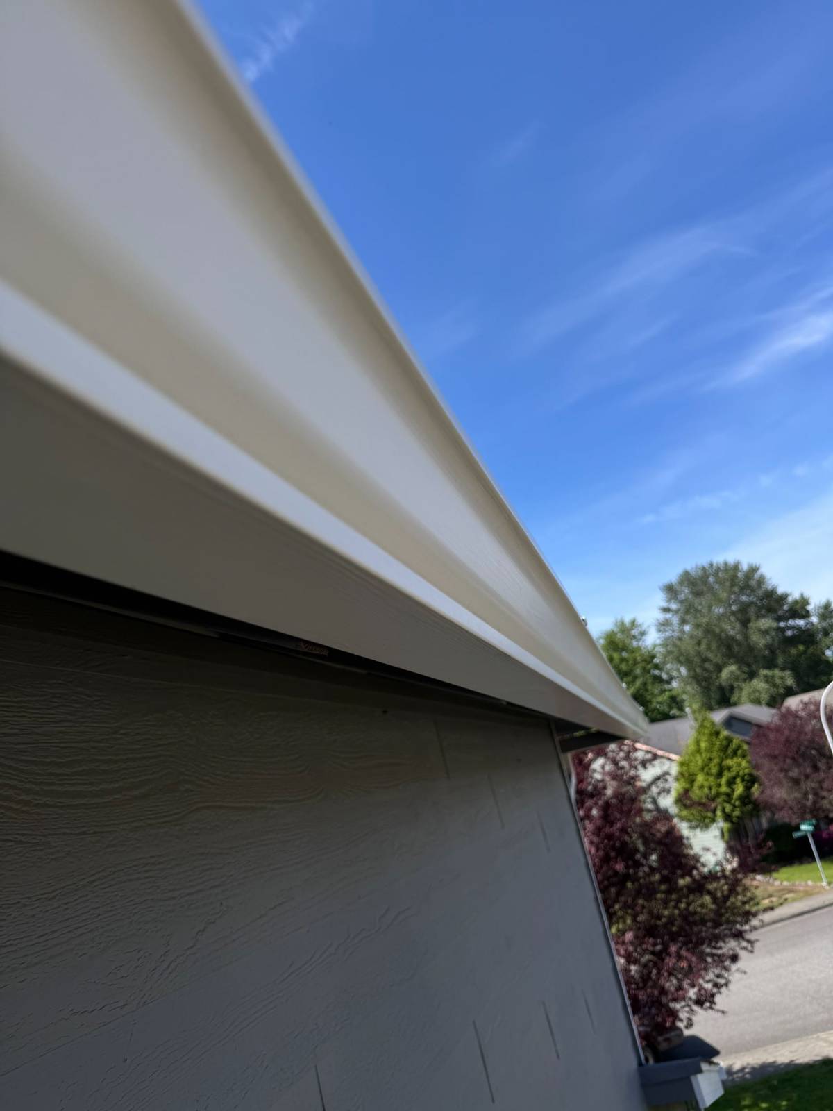 Same gutter exterior cleaned to bright white after professional gutter cleaning